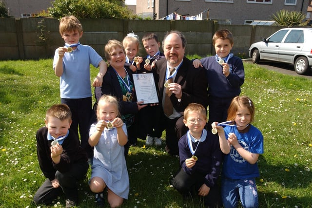 These pupils were proud to show off their medals that they won 15 years ago. Did you keep yours and can you remember what it was for?