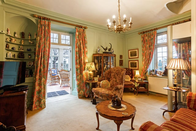 The sitting room gives you direct access to the orangery and has a lift to the first floor nestled in the corner.
