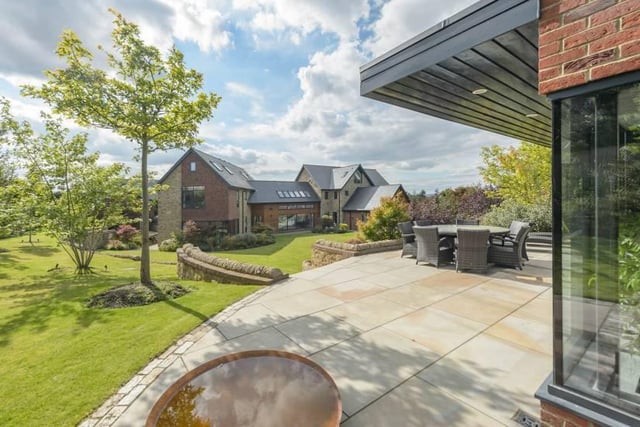 "The extensive plot also provides plenty of car parking (up to 6/8 vehicles) to the front elevation and to the detached triple garage, all accessed and secure from the stone exterior boundary wall and remote electric mono wood gate."