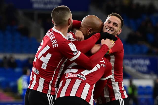 David McGoldrick of Sheffield United celebrates scoring the third goal against Cardiff with Billy Sharp , Conor Hourihane and provider Morgan Gibbs-White: Ashley Crowden / Sportimage