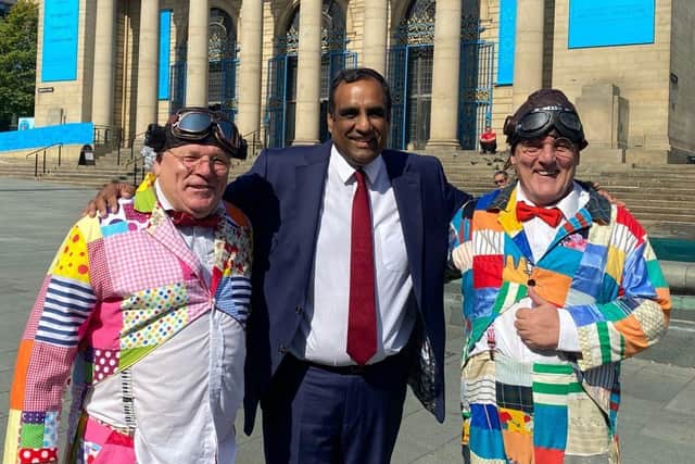 Roy Chubby Brown fans from Sheffield with Liberal Democrat Leader Coun Shaffaq Mohammed outside the City Hall