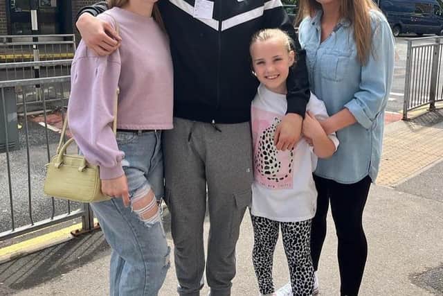 Owen, centre, with his girlfriend Bex, left, sister Skye, eight, and mum Rebecca.