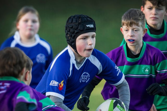 Greg Watson with the ball for Trinity Primary at last week's Hawick youth rugby festival