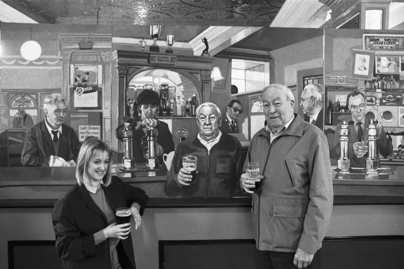 Athletic Arms regular Sandy Dick sees himself as others see him when Edinburgh artist Margaret Milne unveils her painting The Diggers Triptych 1988 at the Edinburgh pub in November 1988.