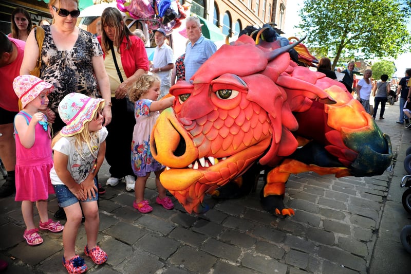 Children meeting Epico the Dragon on his walk about during the Medieval Market in Chesterfield yesterday  back in 2012