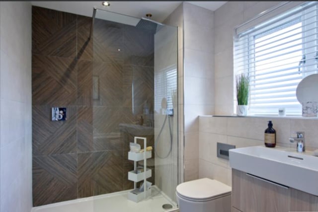 The large family bathroom is modern and stylish.
Image by Robertson Homes.