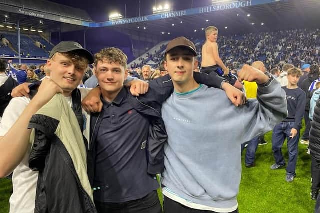 Ross, Rowan and new Sheffield Wednesday fan Oleksiy on the pitch at Hillsborough following the Owls' incredible comeback win over Peterborough United