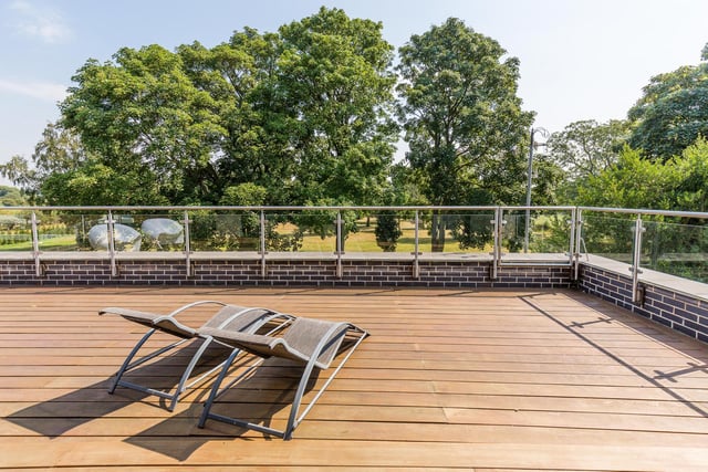 There are "fabulous views" to the rear over open fields and nature reserve from the large decked balcony area leading off the master suite with access to the patio and gardens below by fireman’s pole.