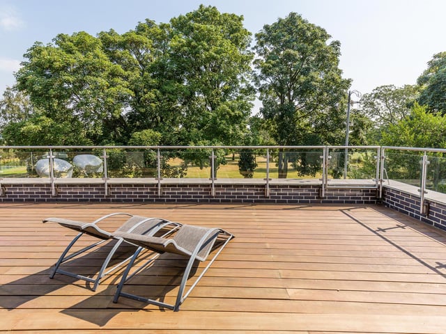 There are "fabulous views" to the rear over open fields and nature reserve from the large decked balcony area leading off the master suite with access to the patio and gardens below by fireman’s pole.