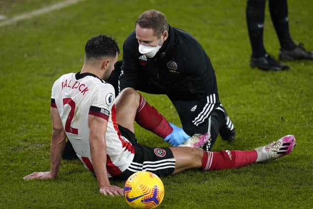 Sheffield United's George Baldock receives treatment for an injury: Tim Keeton/PA Wire.