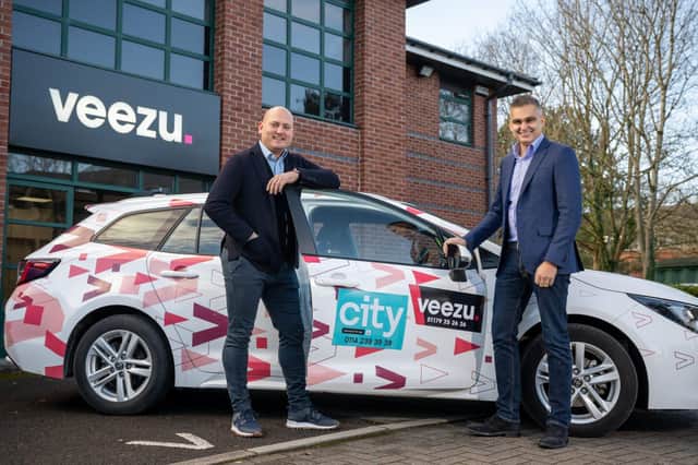 Nathan Bowles, chief executive of Veezu, with Arnie Singh, managing director of City Taxis
