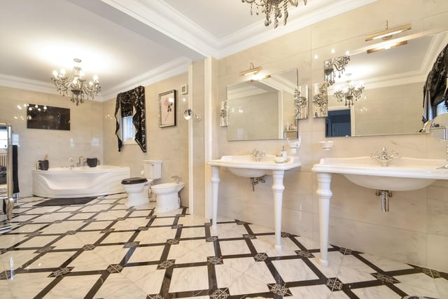 This huge five-bedroom Portsdown Hill home in Portsmouth is up for raffle. Pictured is one of the property's bathrooms, which measures in at 6.93m x 2.39m.