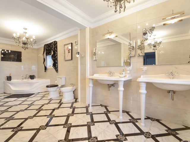 This huge five-bedroom Portsdown Hill home in Portsmouth is up for raffle. Pictured is one of the property's bathrooms, which measures in at 6.93m x 2.39m.