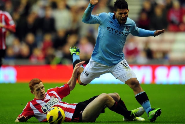 Sunderland's Jack Colback with Manchester City's Sergio Aguero during a Boxing Day Premier League match at the Stadium of Light.