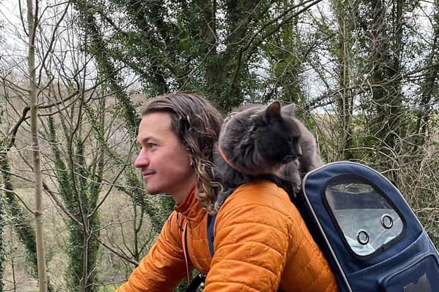 Pōhaku's owner Kyle Kana'iaupuni Robertson describes him as a 'dog-like' adventurous cat who enjoys hikes and bike rides with him and is soon to go on camping trips