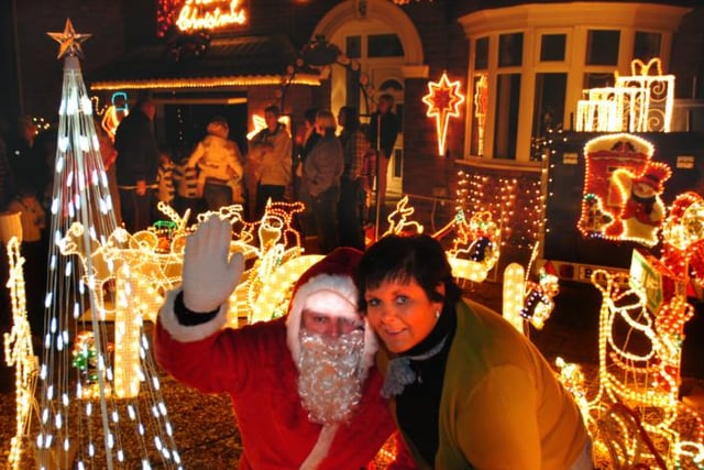 Kay Miller outside of her home in Adwick which is decorated with Christmas lights. 2007.