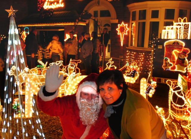 Kay Miller outside of her home in Adwick which is decorated with Christmas lights. 2007.