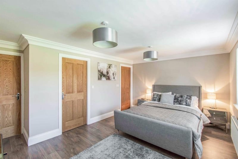 A delightful room with doors giving access to the walk in wardrobe and the ensuite bathroom.