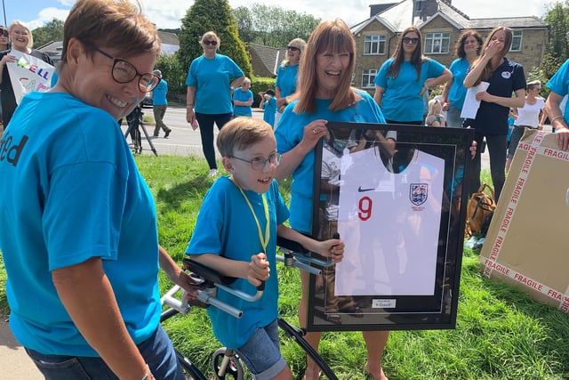 Tobias was presented with a very special England shirt at the finish line