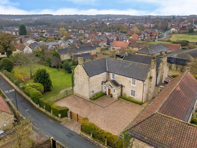 The property is accessed via electric gates which lead to a natural stone-paved courtyard with plenty of space for parking. There is also a garage with storage space.
