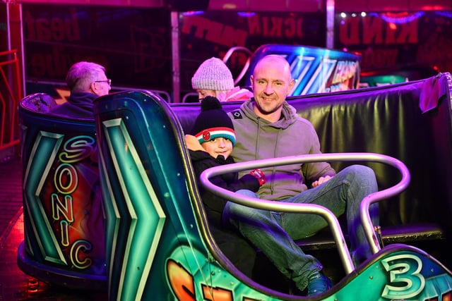 Rocco Paterson, 7, and dad, Andrew Paterson enjoy the Waltzers.
