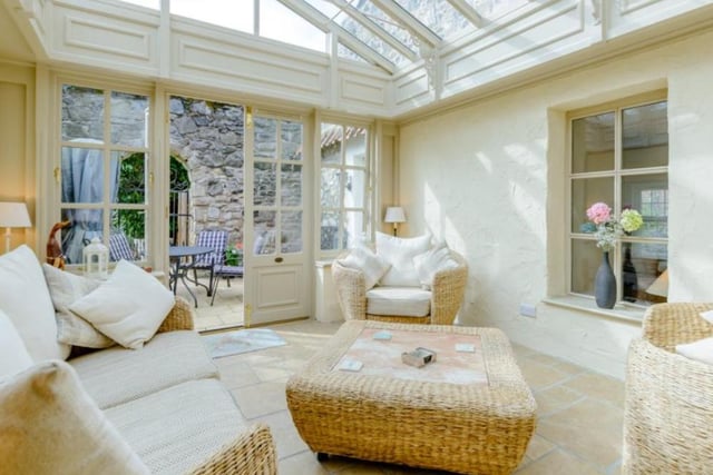 The orangery which is exceptionally light due to its glazed ceiling and French doors.

Picture: Right Move