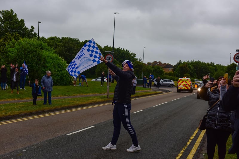 The Hartlepool United open topped bus parade arrives at the junction of The Coast Road and West View Road. 