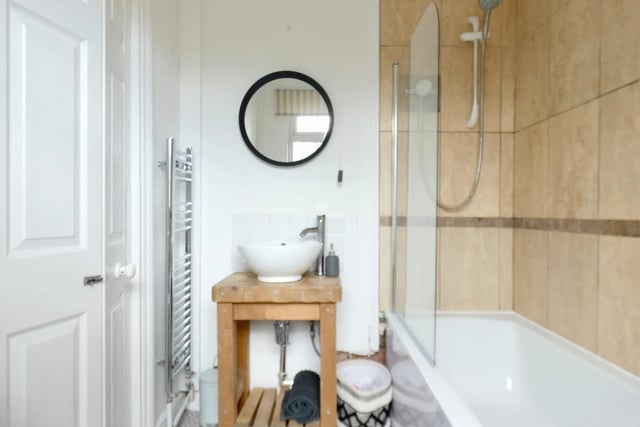 The three-piece bathroom is on the ground floor and is described as modern.