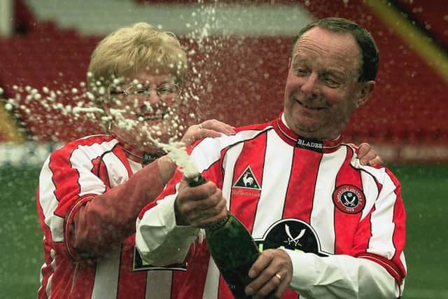 Sheffield United fans Ray and Barbara Wragg celebrate winning the 7,649,520 jackpot from Saturday's National Lottery at Sheffield United's Bramall Lane football ground, Sheffield, Tuesday, 25th January, 2000. A photo: Rui Vieira.