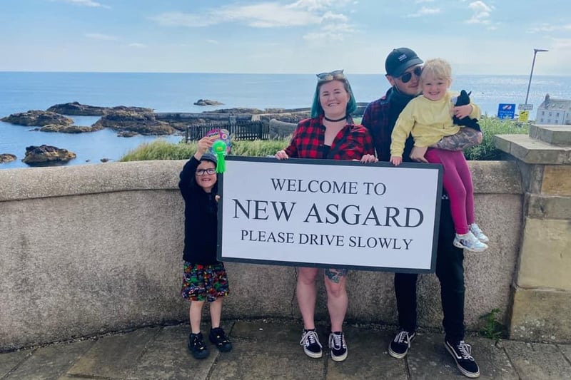 Becky Tierney and family are pictured visiting St Abbs - better known to Marvel fans as New Asgard.