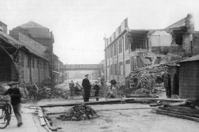 Surveying the damage of a 1941 air raid on Derby Street.