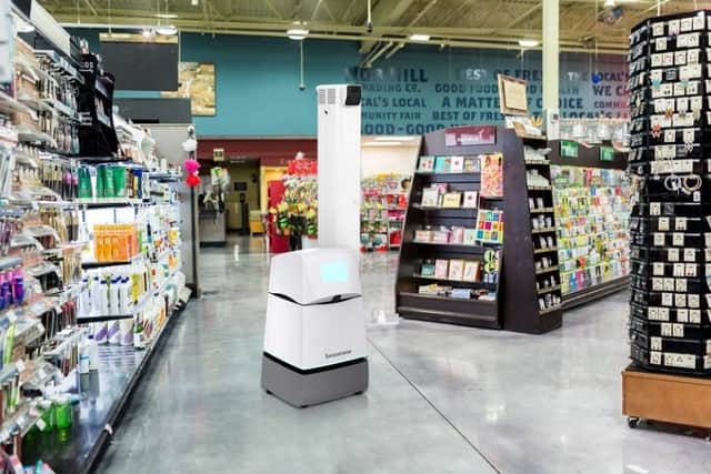 A Bossa Nova robot in a supermarket.