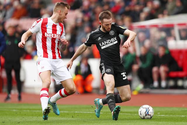 Rhys Norrington-Davies of Sheffield United under pressure from Ben Wilmot of Stoke City (Cameron Smith/Getty Images)