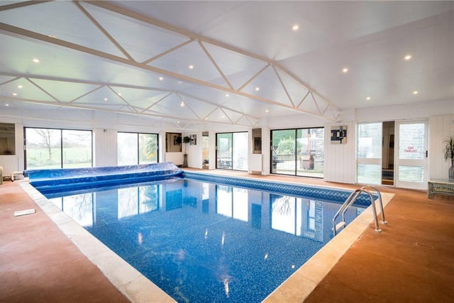 The indoor swimming pool offers a place to both relax and workout, and benefits from changing rooms, a gym area and a sauna, as well as views onto the garden.