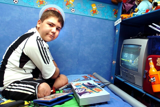 Kyle Barton at home in Shiregreen playing on his Playstation in 2005