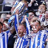 LONDON, ENGLAND - MAY 29: Liam Palmer and Barry Bannan of Sheffield Wednesday celebrate while holding the trophy alongside their teammates after the team's victory and promotion to the Sky Bet Championship in the Sky Bet League One Play-Off Final between Barnsley and Sheffield Wednesday at Wembley Stadium on May 29, 2023 in London, England. (Photo by Richard Heathcote/Getty Images)
