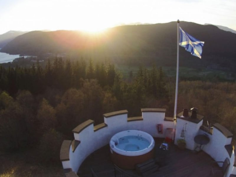 The rooftop hot tub is accessed by stairs from the master bedroom.