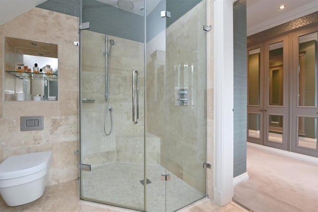 The en-suite is stunning, with a walk-in shower and other bathroom essentials, but is finished beautifully by the tiling. It is access through the dressing area just off from the bedroom.