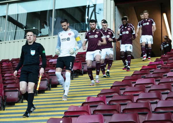 The Hearts players make their way on to the park. Picture: SNS