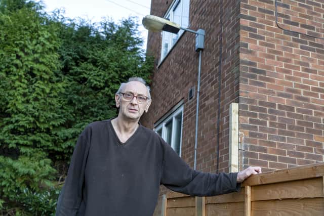 Brian Gleadless outside his home where the street lighting is not working. Picture Scott Merrylees