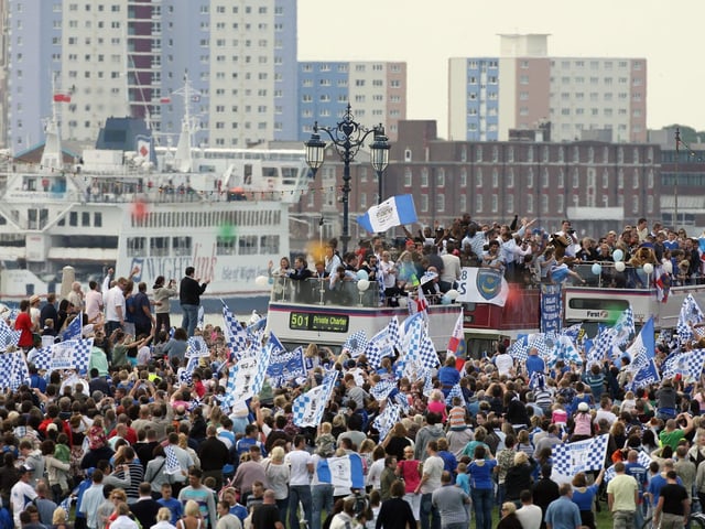 Portsmouth fans celebrate as their team arrive in a open top bus as part of their victory parade at Southsea Common following their win in the FA Cup Final 2008 on May 18 2008 in Portsmouth, England. Picture: Matt Cardy/Getty Images