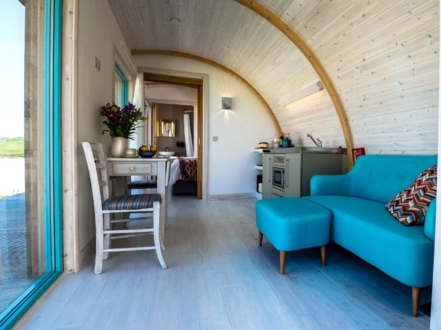 As well as a cosy double room, the cabins are home to a seating area, an en suite with a bath and a shower overhead and a kitchen. There is an outdoor seating area as well to allow guests to admire their coastal view. Linens and fluffy towels are provided, along with luxurious toiletries from the Highland Soap Company.