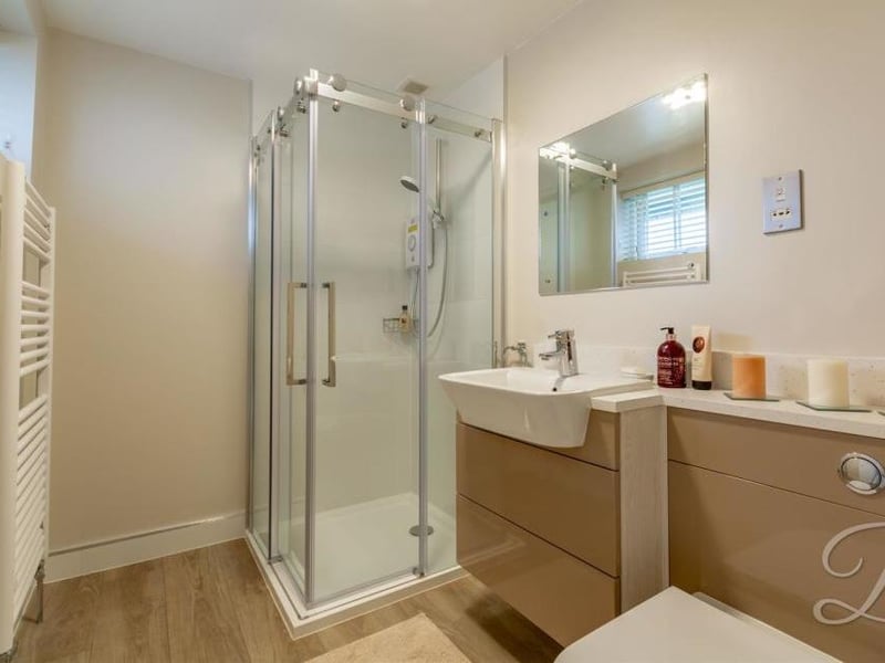 More en-suite delight, thanks to this enclosed shower, low-flush WC and hand-basin. A central-heating radiator is just the job to warm you up on those cold winter mornings.