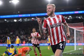 Oli McBurnie celebrates after scoring during the Carabao Cup Third Round match between Sheffield United and Southampton at Bramall Lane (photo by Laurence Griffiths/Getty Images).