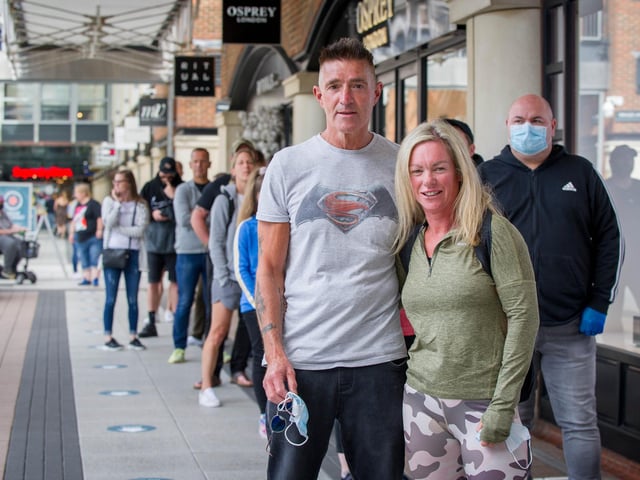 Tony Rothwell and Tina Holland outside Nike store.