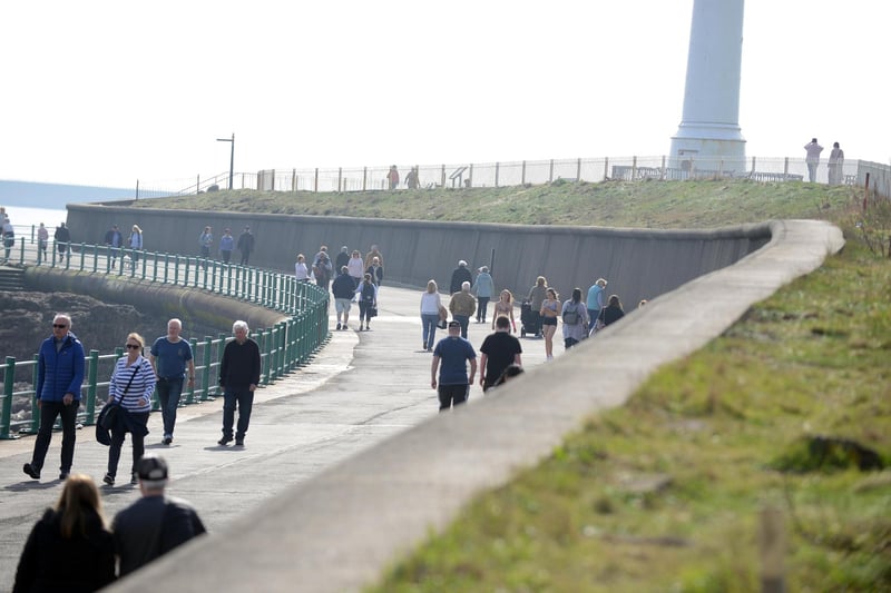 People enjoying Sunderland's coastline on a Wednesday walk.