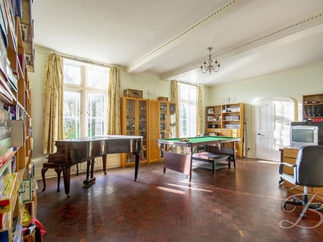 The large room in the centre of the house is currently used as a games room.
