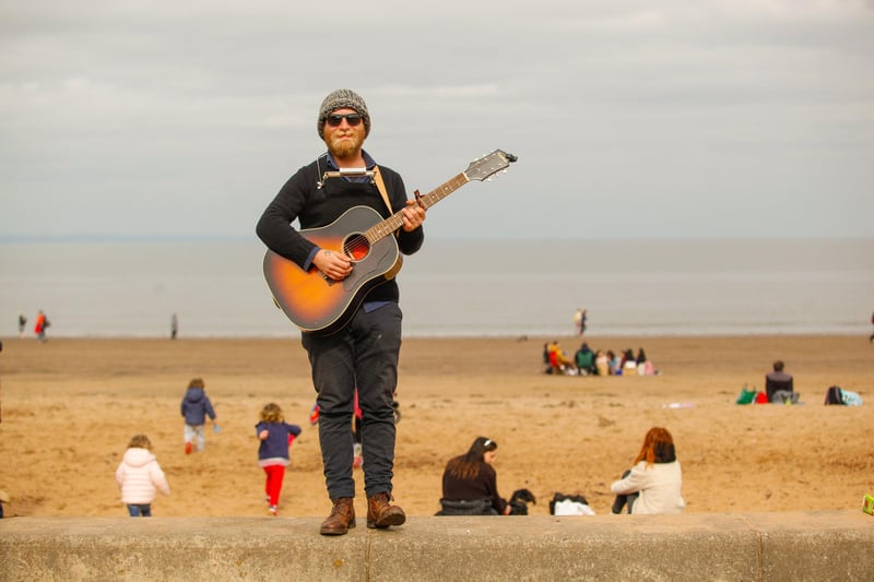 Musician Rick Giujisa spotted doing a bit of busking as crowds visit Porty beach the day lockdown restrictions ease.
