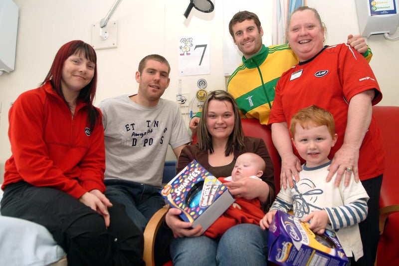 Mansfield Town FC players present Easter eggs to children on the Robin Hood ward at King's Mill Hospital on behalf of JJB Fitness Club. 
Pictured, from left, are Tracy Clements, of JJB, Stags player Jake Buxton, Vicki Caylow from South Normanton with five-month-old baby Frankie, Keith Briggs, of Mansfield Town FC and Tracey Howard, of JJB, with Frankie's brother, William, aged three.