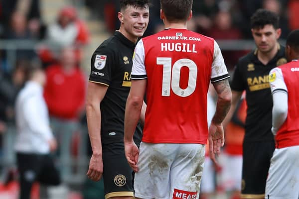 Anel Ahmedhodzic of Sheffield United exchanges words with Jordan Hugill of Rotherham: Simon Bellis / Sportimage